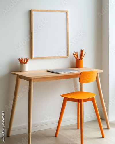 Stylish workspace featuring a wooden desk, orange chair, and empty frame, perfect for home office inspiration.