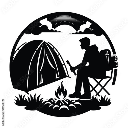 A silhouette of a person camping by the fire