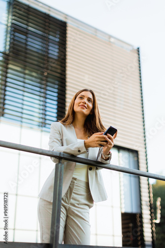 Smiling business woman enjo...