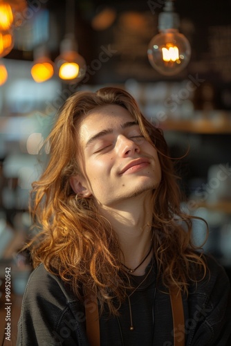 Man with a peaceful expression closes his eyes as she enjoys his coffee, embracing the warmth of the café