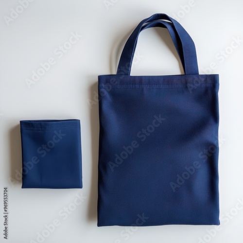 Classic Navy Blue Fabric Tote Bag and Matching Accessory Set on White Background photo