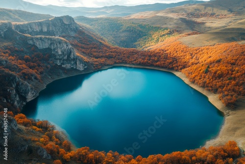 pristine lake in autumn in the mountains aerial drone view