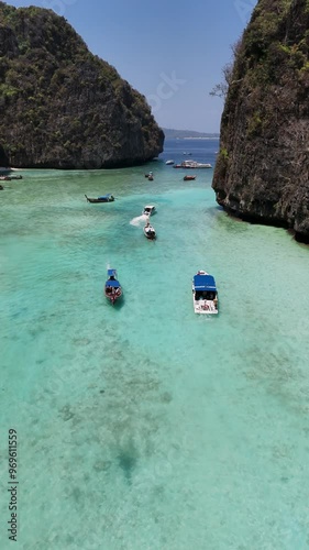 tropical vacation in Thailand, aerial view of Pileh lagoon and Koh Phi Phi island on Thai resort, idyllic exotic landscape with traditional Thai boat in Maya bay. High quality 4k footage photo