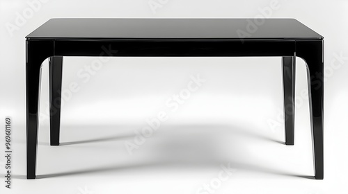 Sleek and sophisticated black lacquered dining table with a contemporary minimalist design isolated on a clean white background for a high end modern interior or product photography setting