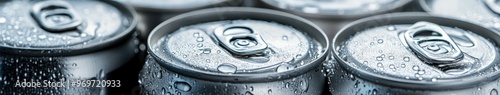 Refreshing beverage cans with condensation close-up on a summer day photo