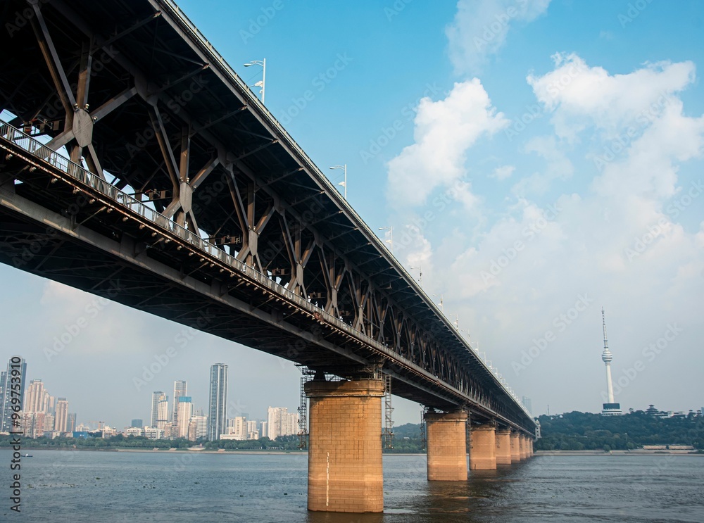 Fototapeta premium Large steel railway bridge with wide highways spanning the Yangtze River in Wuhan, China