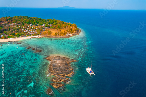 Aerial view landscape with white yacht catamaran in Phi Phi Don Thailand. Tourist boat trip in Thai travel banner concept photo