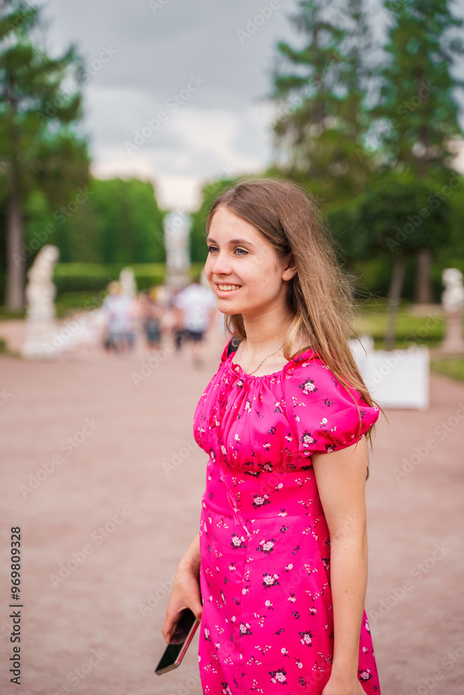 Portrait of a beautiful Caucasian girl in a bright dress in summer. Portrait of a beautiful Caucasian girl in a bright dress in summer.