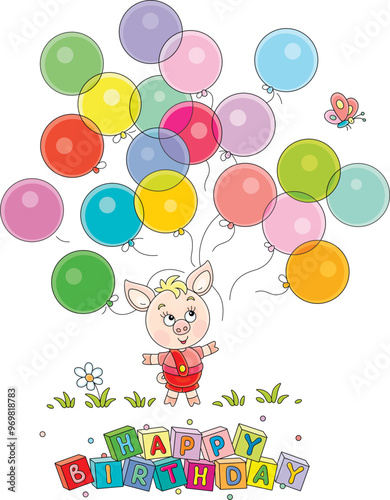 Happy birthday card with a funny cartoony little piglet playing with colorful toy balloons and merry butterfly on a green summer lawn, vector cartoon illustration on a white background