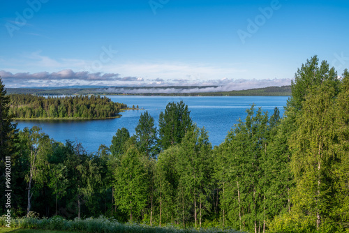 Fog lifts from a lake in Northern Sweden.