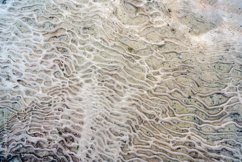 Obraz na płótnie A close-up of Pamukkale's unique geological formations, featuring intricate patterns of white calcium carbonate deposits. w salonie