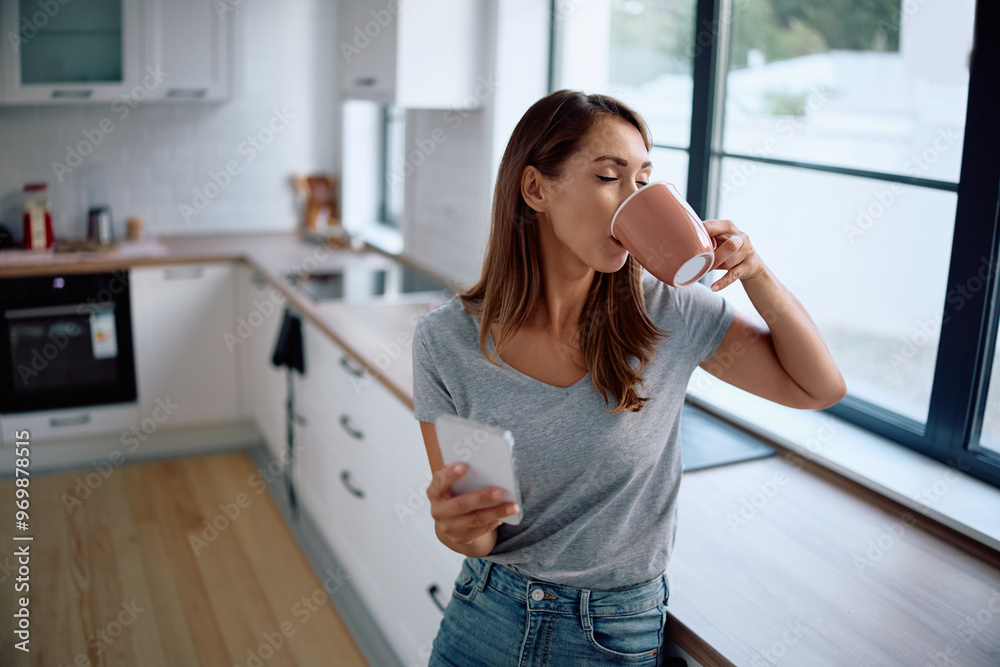 Young woman enjoying in taste of fresh coffee in kitchen. Young woman enjoying in taste of fresh coffee in kitchen.