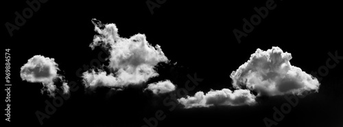 sunlit white curly clouds on black isolated background