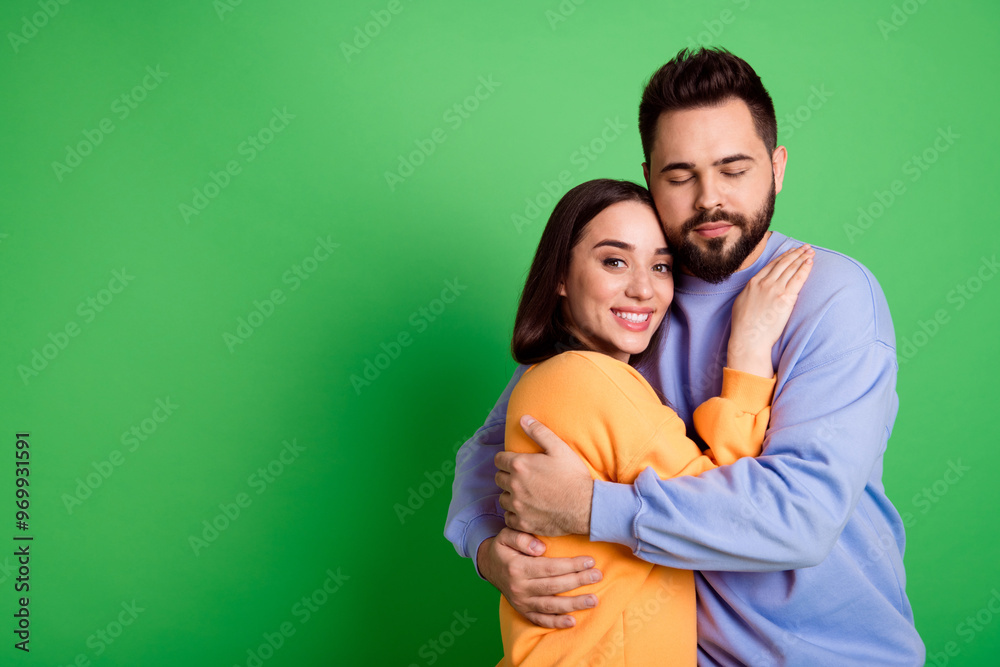 Obraz premium Photo of charming lovely cute couple wear stylish clothes empty space isolated on green color background