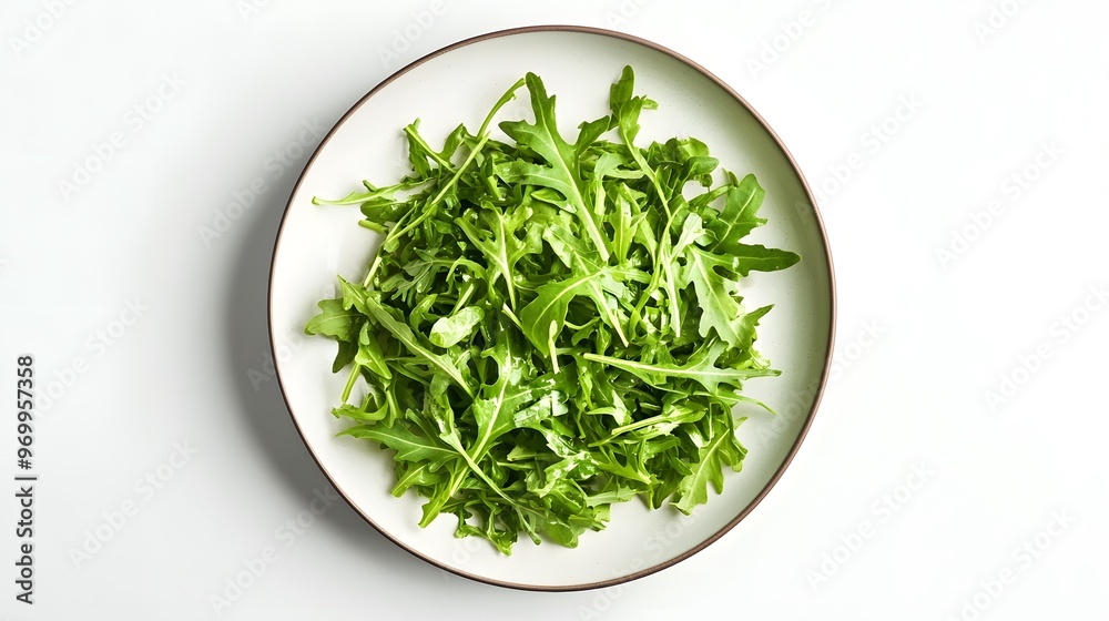 Fresh arugula salad on white plate – healthy and delicious green leafs Fresh arugula salad on white plate – healthy and delicious green leafs