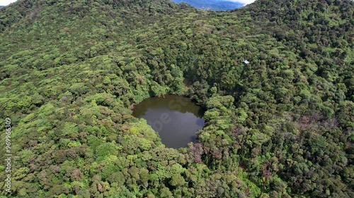 Beautiful cinematic aerial view of the Barva Volcano in the Braulio Carrillo National Park, its dens rain forest  in Costa Rica