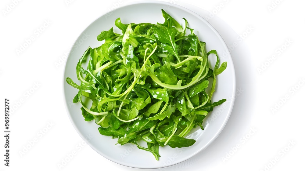 Fresh arugula salad on white plate with olive oil and salt Fresh arugula salad on white plate with olive oil and salt