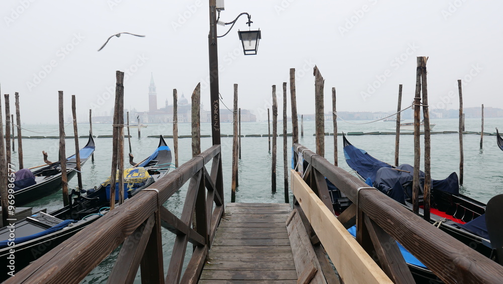 Venice in December, shrouded in mist and without sunlight, captures a serene and atmospheric winter beauty. Historic canals, iconic landmarks, and a tranquil ambiance define this unique, foggy scene. Venice in December, shrouded in mist and without sunlight, captures a serene and atmospheric winter beauty. Historic canals, iconic landmarks, and a tranquil ambiance define this unique, foggy scene.