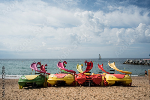 pedal boats on the beach in summer photo