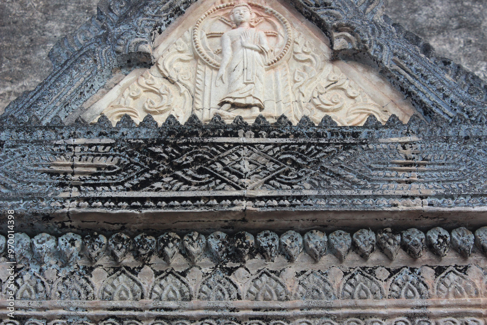 Intricate Stone Carving of Buddha in Ancient Temple
