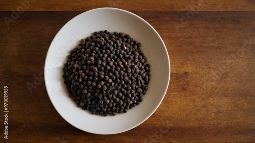 Raw Spices Image of a Black Pepper in the plate.