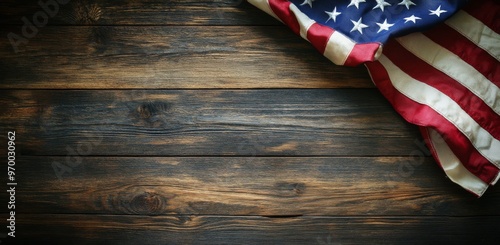 American flag draped over rustic wooden surface in a calm, patriotic setting
