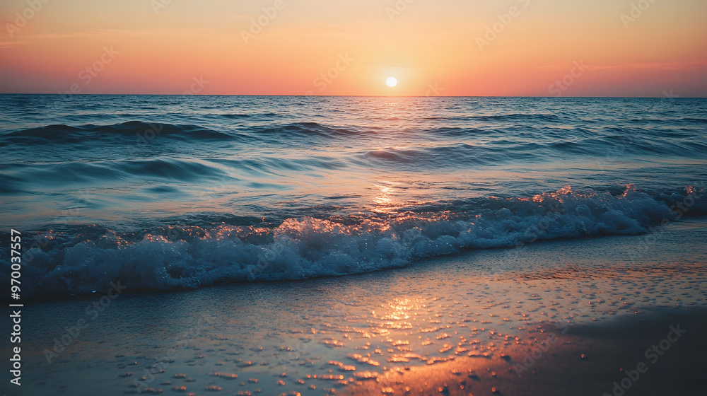 A serene ocean view from a peaceful beach with gentle waves lapping against the shore and the sun setting in the distance. A serene ocean view from a peaceful beach with gentle waves lapping against the shore and the sun setting in the distance.