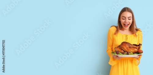 Happy young woman holding t...