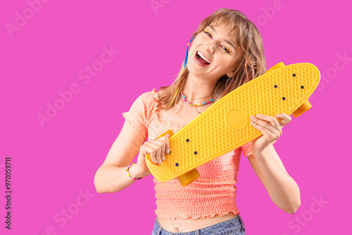Young woman with skateboard...