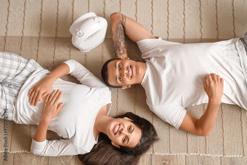 Young couple with electric ...