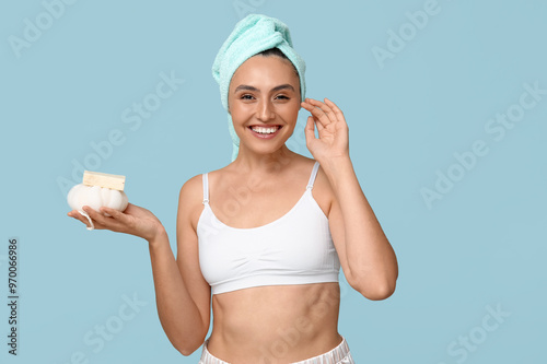 Smiling woman with towel on...