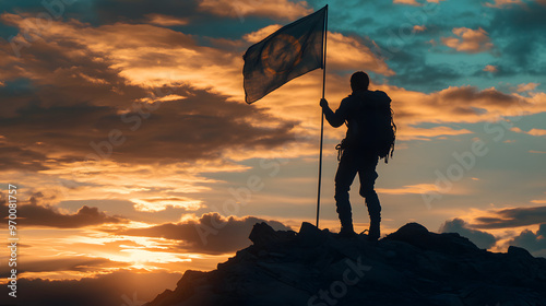 A person planting a flag on a newly reached summit symbolizing personal achievement and conquest. photo