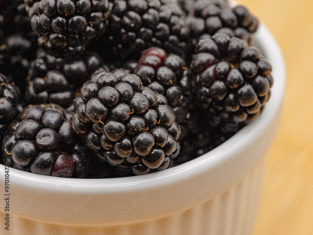 Rip blackberries in a white bowl close up Rip blackberries in a white bowl close up