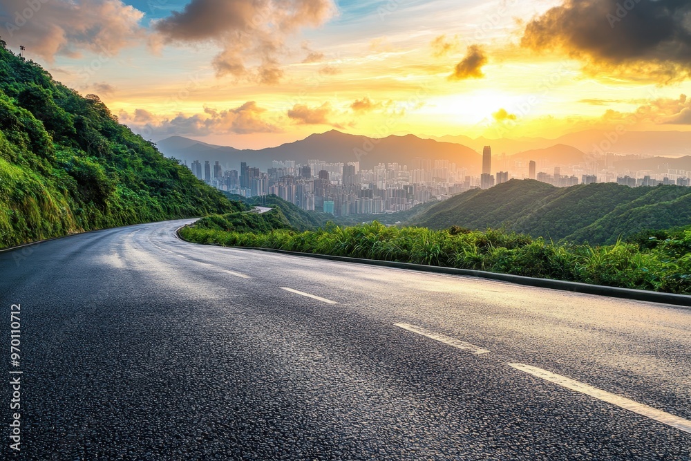 Fototapeta premium Sunset city skyline with asphalt highway and green mountain