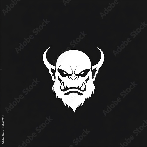 Angry white orc head with horns on black background photo