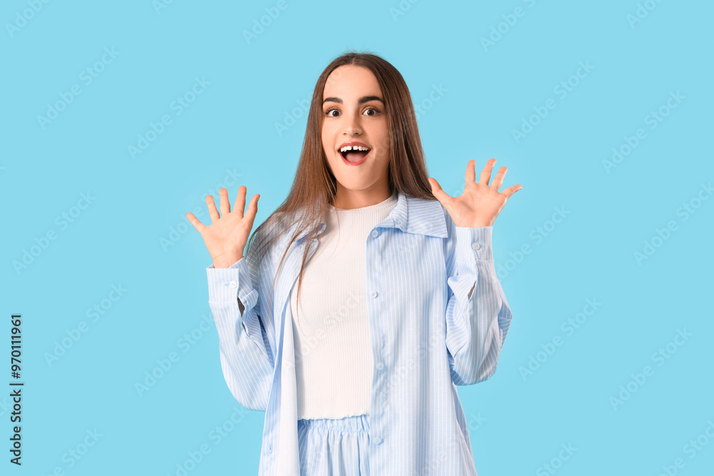 Young surprised woman on blue background Young surprised woman on blue background