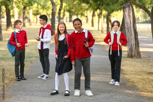 Group of happy pupils going...