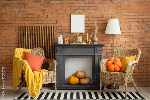 Fireplace, armchairs and pumpkins in autumn living room