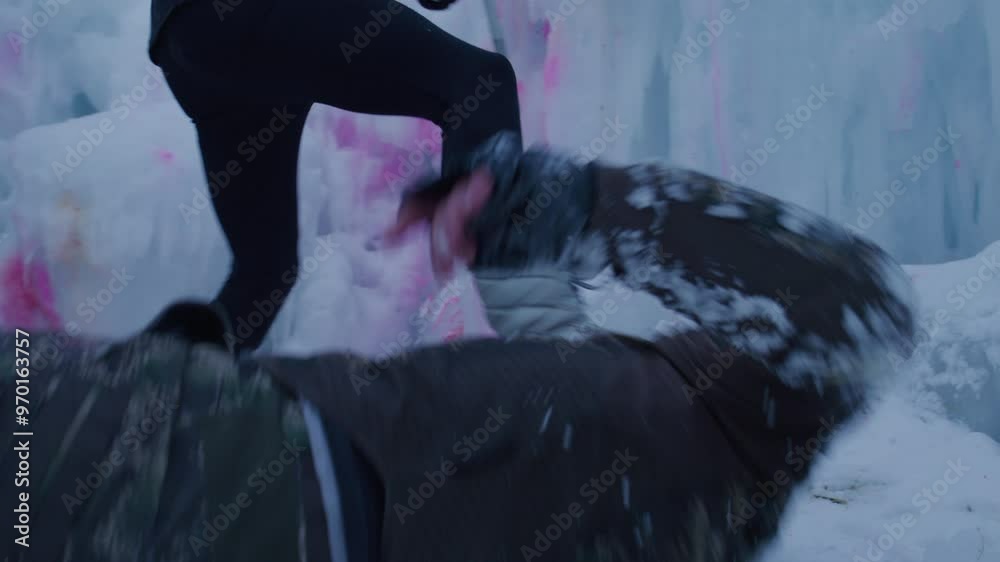 Man reaching for paintball gun but getting shot by woman - shaky cam Man reaching for paintball gun but getting shot by woman - shaky cam