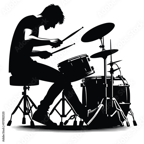 Silhouette of a drummer playing drums