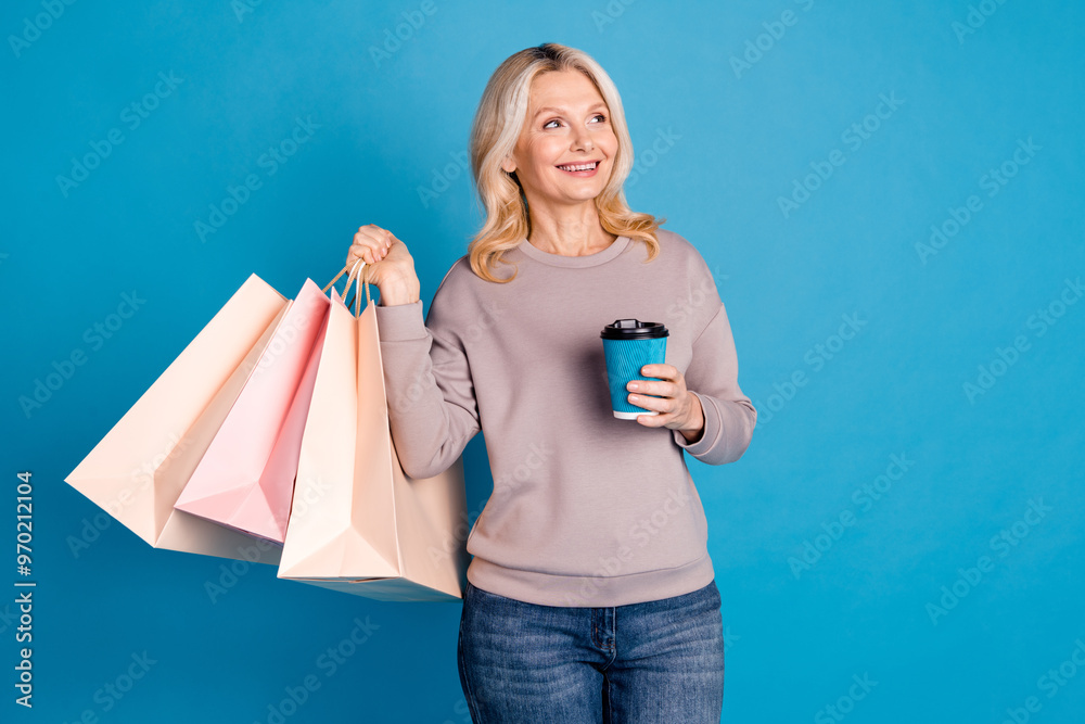 Φωτογραφία Photo of senior lady hold shopping bags coffee paper cup look empty space dresse