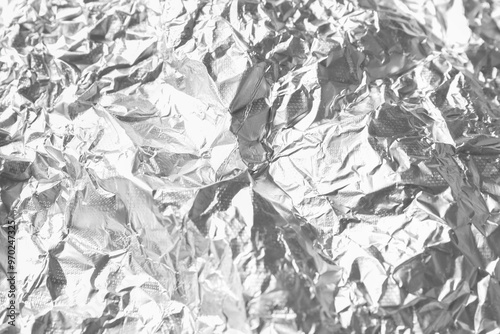 Shiny silver tinfoil surface as background, closeup