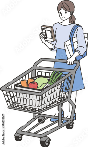 商品を確認しながら買い物する女性