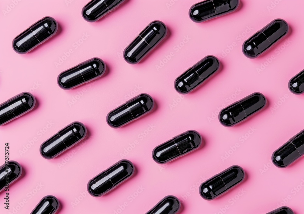 black capsules, supplements, dietary pills arranged in a repeating pattern on a vibrant pink background, showcasing minimalistic design and modern aesthetics