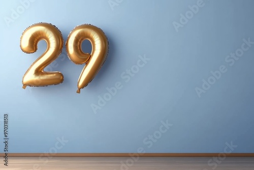 Golden Number 29 Foil Balloons on Minimalist Blue Background – Birthday Celebration Concept photo