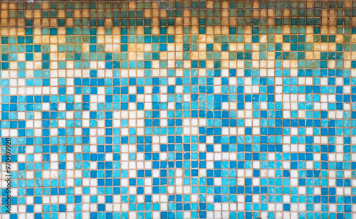 A blue and white tile wall with a pattern of squares