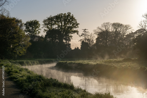 A beautiful shot of water vapor steam rises from the Karamu Stream in Havelock North, in the Hawke's Bay of New Zealand on a cold spring morning.