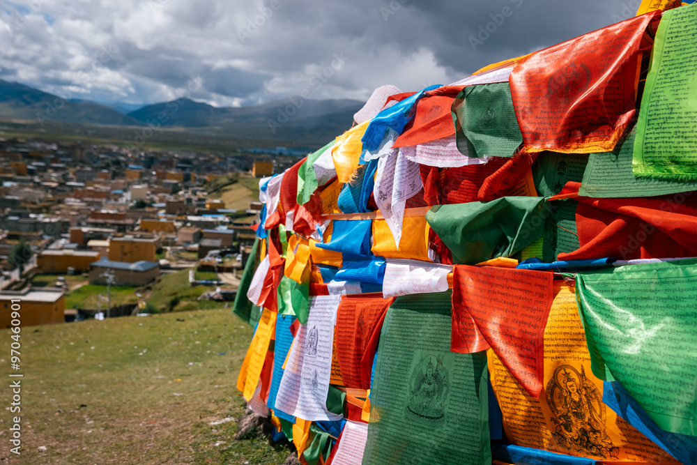 The Changqing Chunker Temple in Litang, China. Many colourful prayer flags on the mountain top beside the temple.Spirituality and meditation. The Changqing Chunker Temple in Litang, China. Many colourful prayer flags on the mountain top beside the temple.Spirituality and meditation.