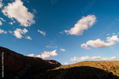 Dramatic late afternoon light and shadows at Ormiston Gorge in the West MacDonnell Ranges in central Australia photo