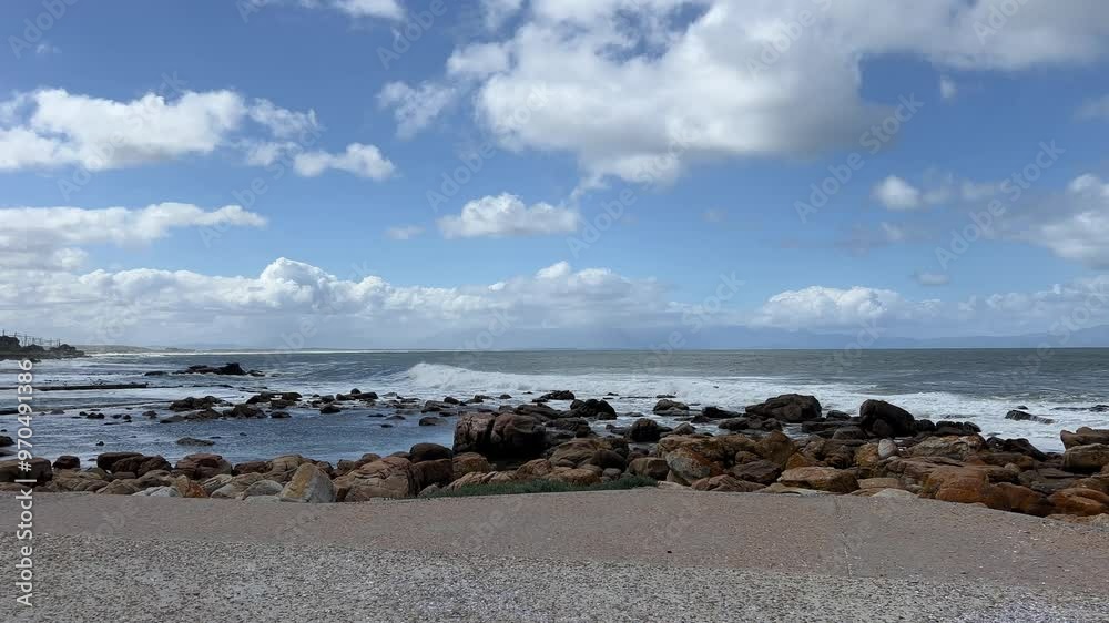 Waves smashing into the tidal pool along a rocky beach Waves smashing into the tidal pool along a rocky beach